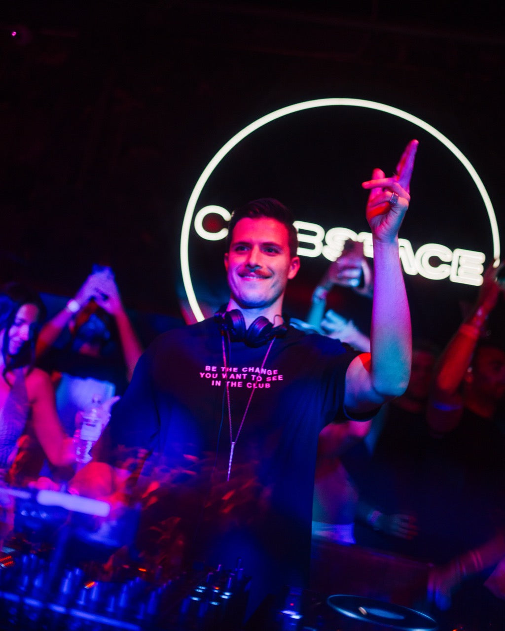 Enamour wearing the BE THE CHANGE shirt at Space Miami